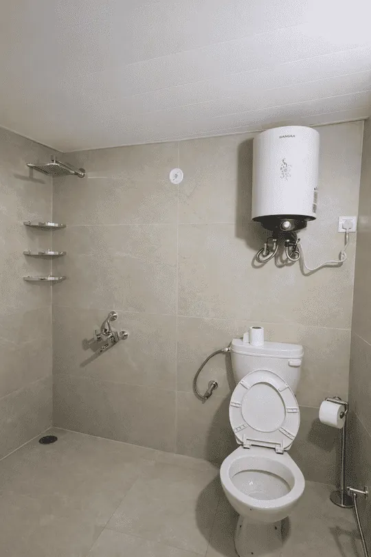 Tiled bathroom with rain shower and hot-water geyser at Haus of Shizu private stay in Kasar Devi