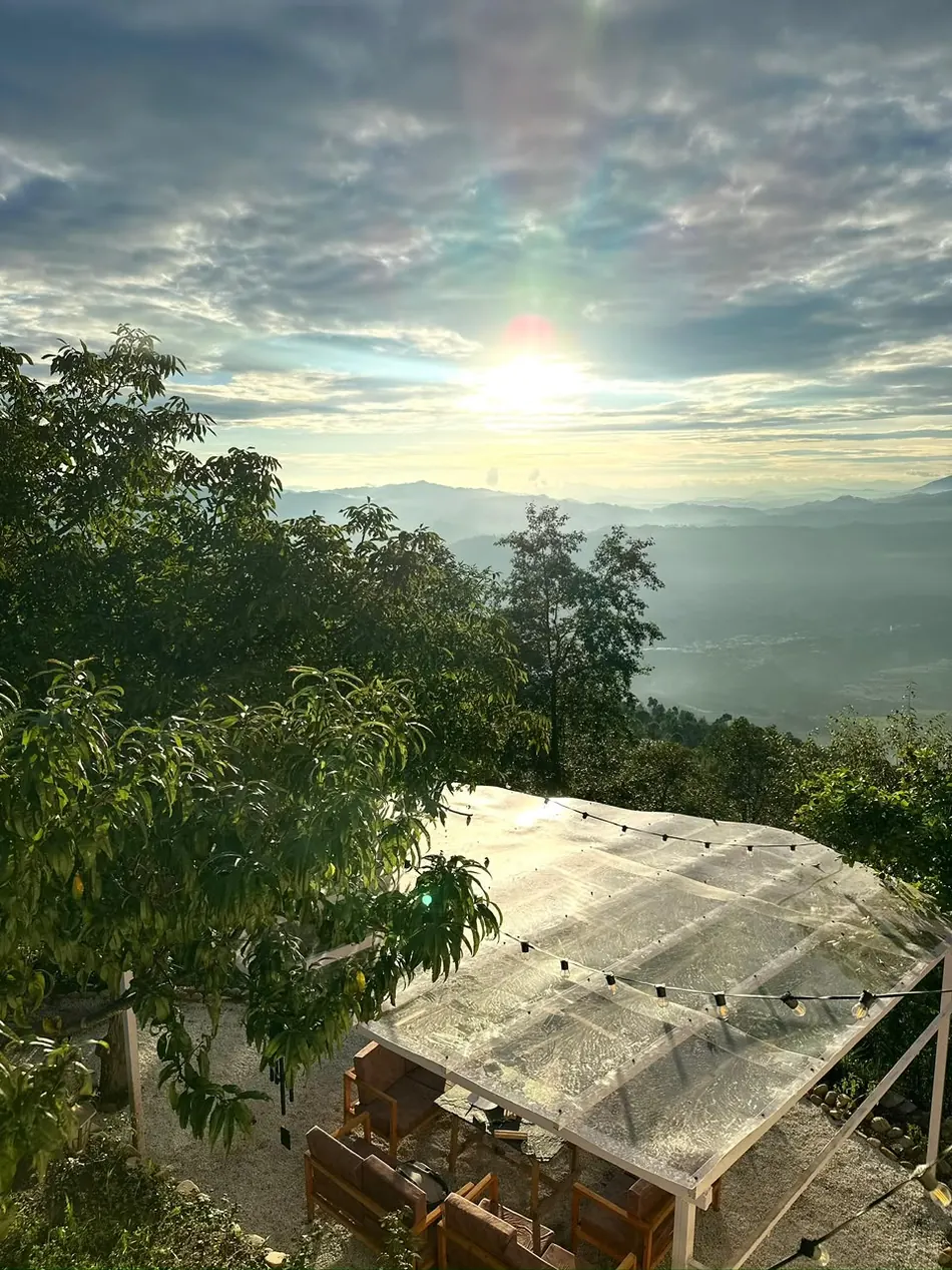 Sunrise over the Kumaon valleys from the rooftop at Haus of Shizu, Kasar Devi