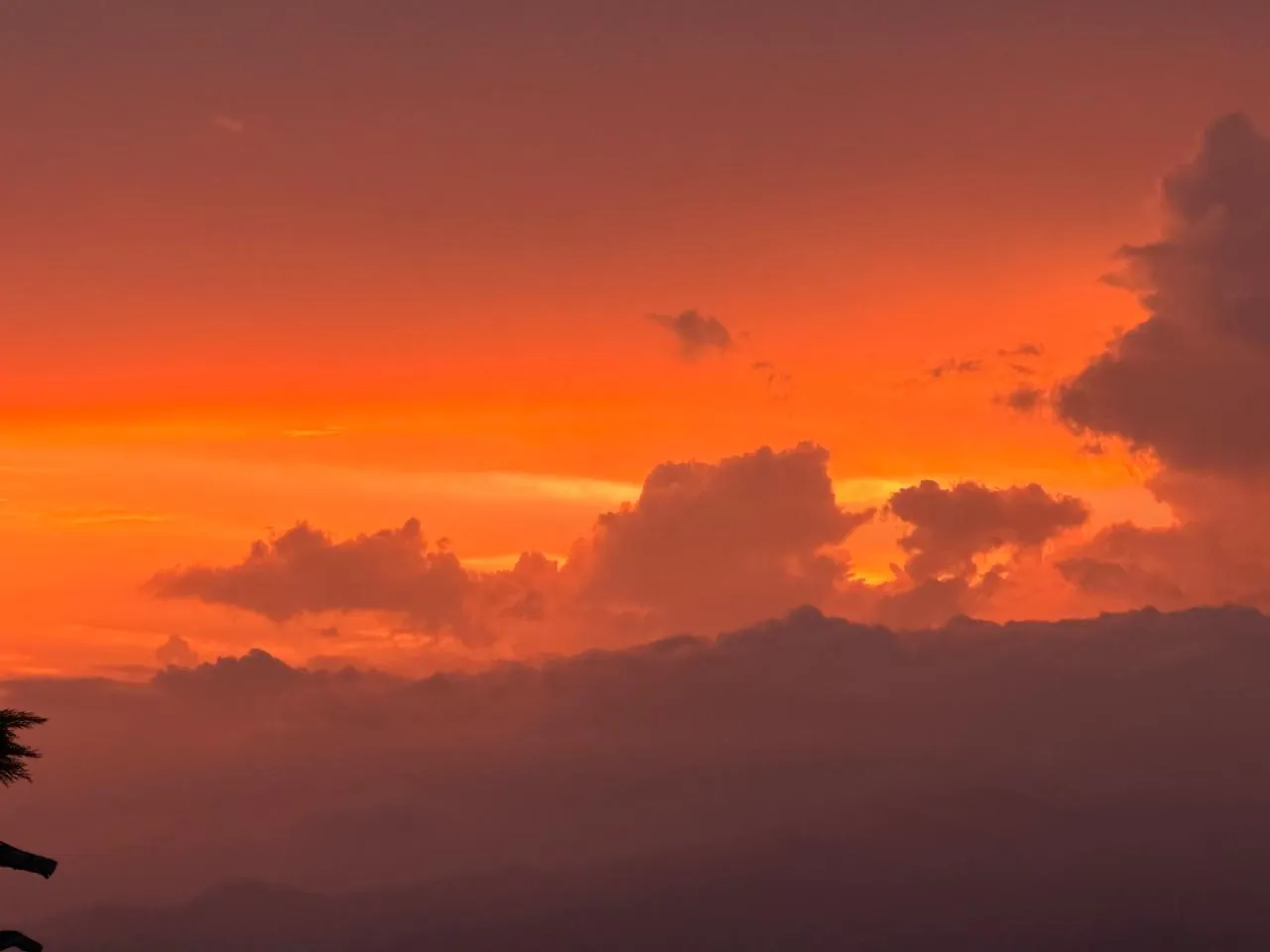 Orange sunset sky over the Kumaon hills from Haus of Shizu, Kasar Devi